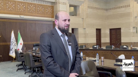 Plt perdana Menteri Suriah Mohamed al-Bashir menghadiri pertemuan dengan kabinet transisi, setelah pemberontak Suriah menggulingkan Presiden Bashar al-Assad, di Damaskus, Suriah, 10 Desember 2024. Foto: Al Arabiya TV/ via Reuters