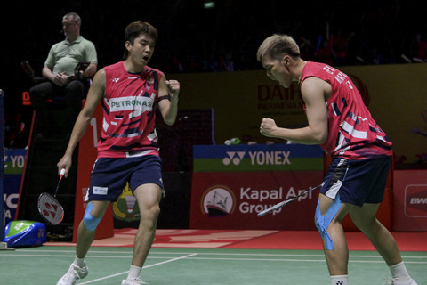 Pasangan Badminton dari Malaysia Man Wei Chong/Kai Wun Tee. Foto: Bay Ismoyo/AFP