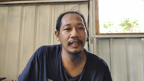 Andre Surawan alias Tikus, personel Poem Bengsing. Foto: Arfiansyah Panji Purnandaru/kumparan