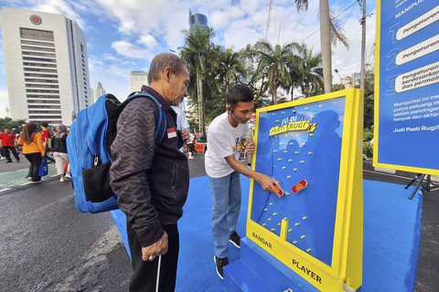 Kampanye Judi Pasti Rugi saat CFD di Jakarta, Minggu (6/7/2025).  Foto: Argya D. Maheswara/kumparan 