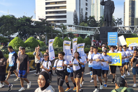 Kampanye Judi Pasti Rugi saat CFD di Jakarta, Minggu (6/7/2025). Foto: Argya D. Maheswara/kumparan