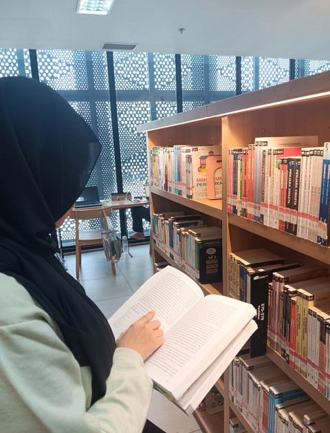 Ilustrasi anak yang sedang membaca buku. (Perpustakaan Jakarta)