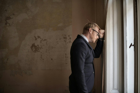 https://www.pexels.com/photo/desperate-evicted-male-entrepreneur-standing-near-window-3771129/