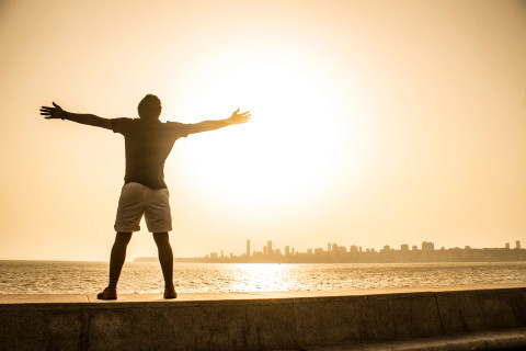https://www.pexels.com/photo/man-standing-on-ledge-while-spreading-arms-1462640/