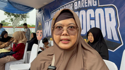 Laela, warga yang membuat paspor di CFD Tegar Beriman, Cibinong, Kab Bogor, Minggu (31/5/2026). Foto: Nauval Pratama/kumparan