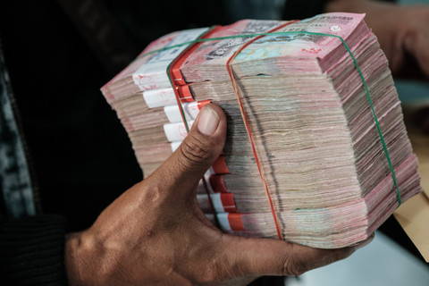 Ilustrasi rupiah. Foto: Yasuyoshi Chiba/AFP