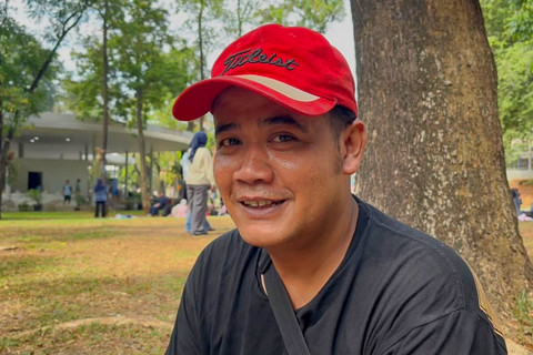 Sahrul (38), warga yang berakhir pekan di Tebet Eco Park, Jakarta Selatan, Minggu (15/6/2026). Foto: Nauval Pratama/kumparan