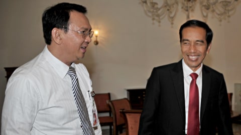 Presiden Joko Widodo bersama Mantan Gubernur DKI Jakarta Basuki Tjahaja Purnama pada 23 Juli 2014. Foto: AFP/BAY ISMOYO