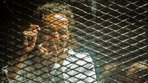 Ilustrasi jurnalis dalam penjara. Foto: AFP/Mohamed el-Shahed