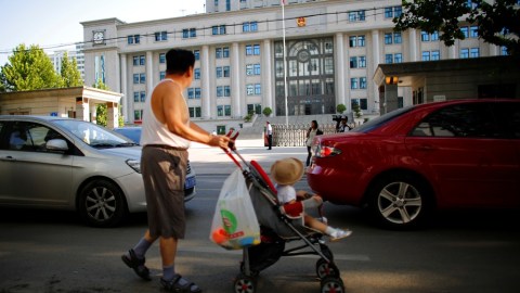 Keluarga di China  Foto: Carlos Barria/Reuters