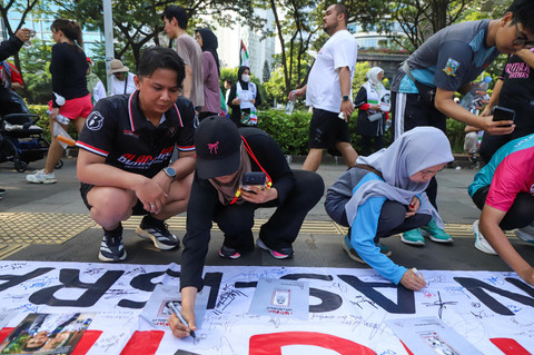 Foto: Warga di CFD Jakarta Gelar Aksi Support Iran dan Palestina