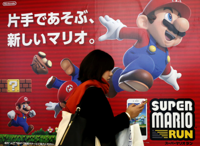 Iklan game terbaru Nintendo, Super Mario Run, di salah satu jalanan di Jepang Foto: Reuters