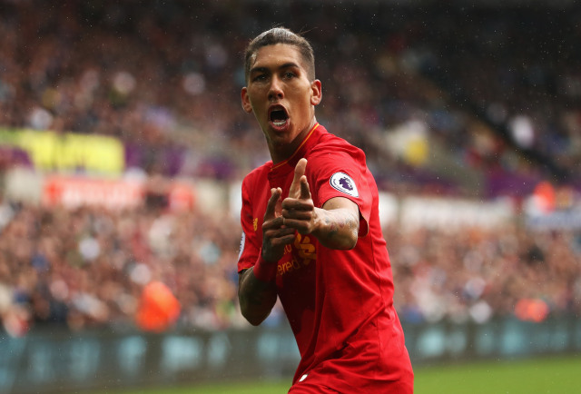 Firmino sedang merayakan gol untuk Liverpool. (Foto: Getty Images)
