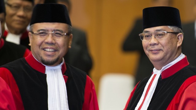 Patrialis Akbar dan M. Akil Mochtar saat 2013 (Foto: Widodo S. Jusuf/ Antara)