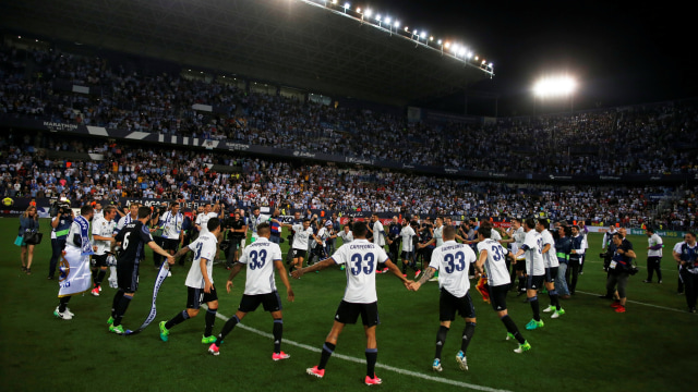 Pesta juara Madrid di Malaga. (Foto: Reuters/Jon Nazca)