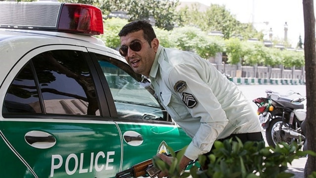 Polisi saat kejadian penembakan di Tehran, Iran. Foto: Tasnim News Agency via REUTERS 
