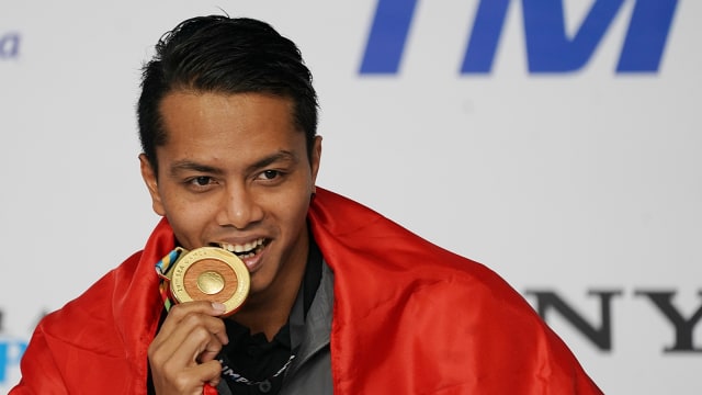 I Gede Siman Sudartawa ketika meraih emas di Asian Games 2018. Foto: Antara/Sigid Kurniawan