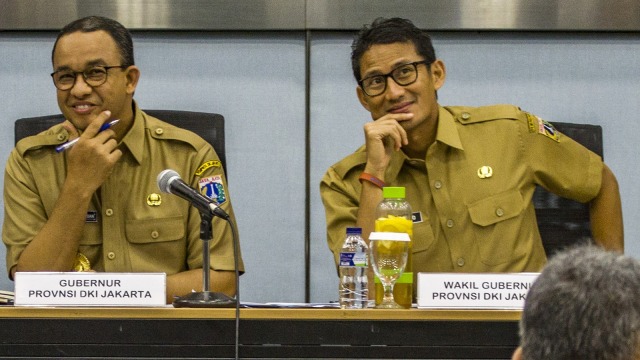 Anies Baswedan dan Sandiaga Uno (Foto: Antara/Galih Pradipta)