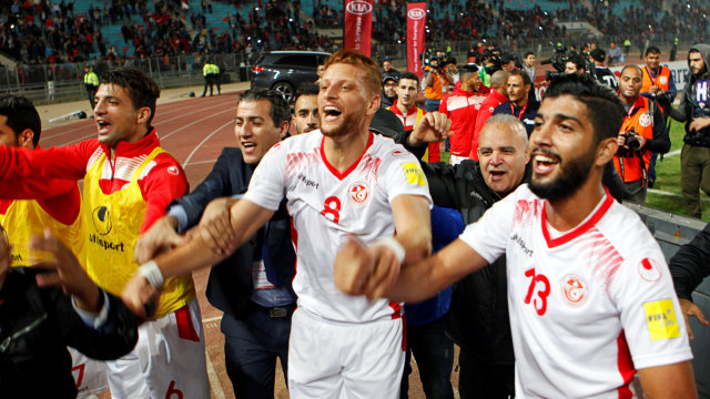 Pemain Tunisia merayakan lolos ke Piala Dunia (Foto: REUTERS/Zoubeir Souissi)