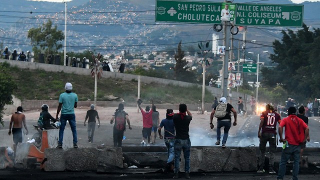 Kerusuhan di Honduras. (Foto: Orlando Sierra/AFP)