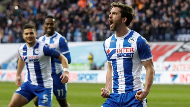 Will Grigg merayakan gol. (Foto: Reuters/Carl Recine)
