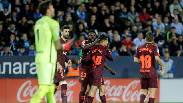 Para pemain Barcelona merayakan gol. (Foto: Reuters/Jon Nazca)