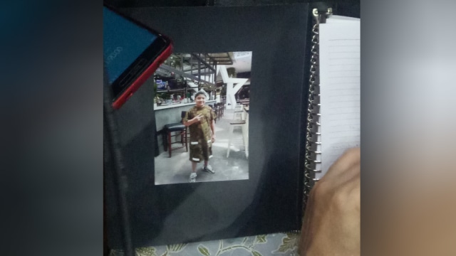 Foto anak Setya Novanto di buku pribadinya (Foto: Aprilandika Pratama/kumparan)