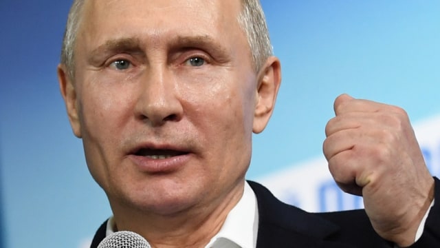 Vladimir Putin di Pemilu Rusia (Foto: POOL/REUTEURS)
