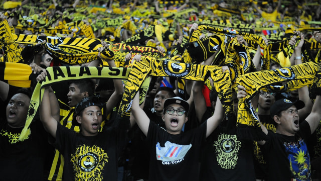 Suporter Timnas Malaysia (Foto: ADEK BERRY/AFP)