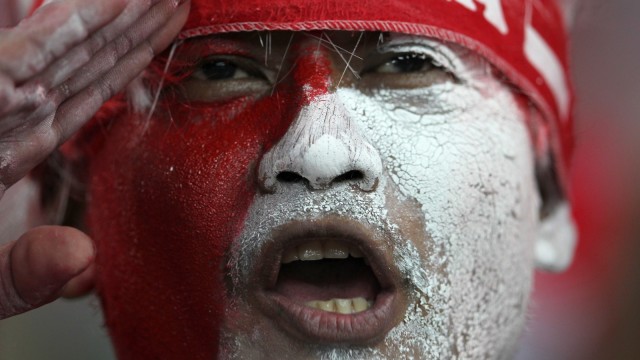 Suporter Timnas Indonesia. (Foto: Mohd Rafsan/AFP)