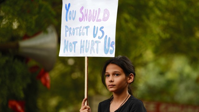 Protes perkosaan bocah di India. (Foto: AFP/Punit Paranjpe)