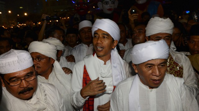 Jokowi sambut Idul Adha. (Foto: AFP/Romeo Gacad)