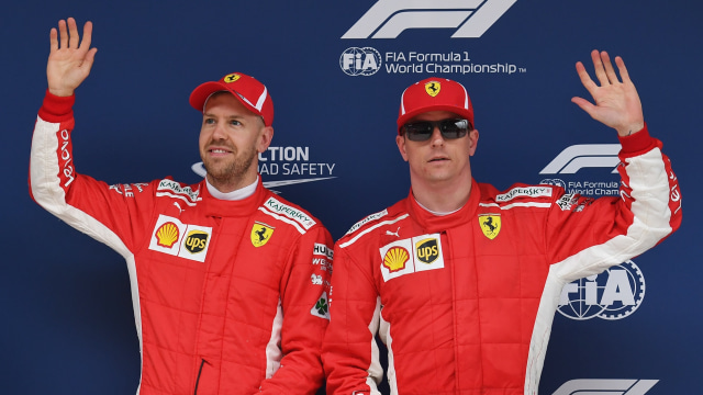 Dua pebalap Ferrari, Vettel dan Raikkonen. (Foto: GREG BAKER / AFP)