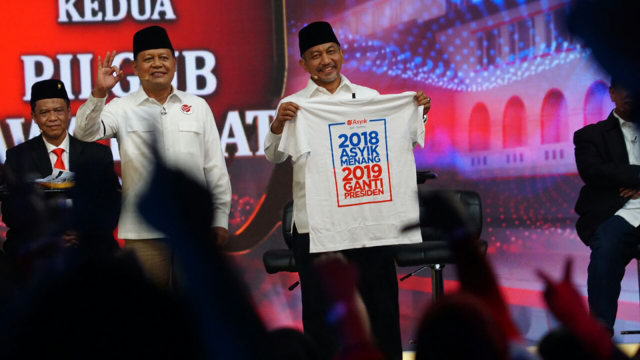 Kaos 2018 asyik Menang 2019 Ganti Presiden. (Foto: Iqbal/kumparan)