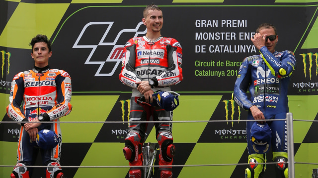 Lorenzo, Rossi, dan Marquez di atas podium. (Foto: REUTERS/Jon Nazca)