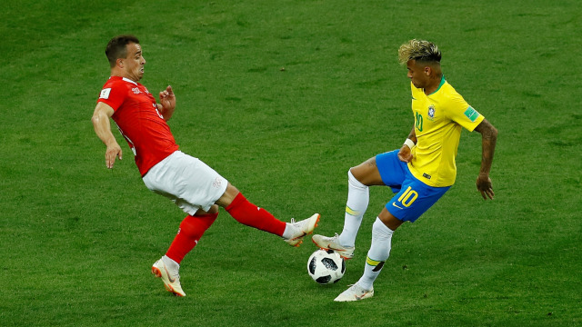 Duel di laga Brasil vs Swiss. (Foto: REUTERS/Jason Cairnduff)