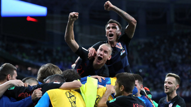 Para pemain Kroasia merayakan gol. (Foto: REUTERS/Ivan Alvarado)