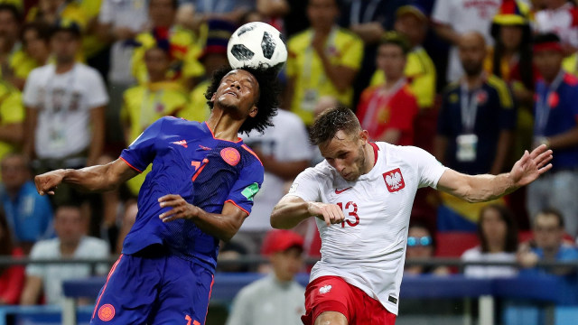 Pemain Polandia dan Kolombia berduel. (Foto: REUTERS/Sergio Perez)