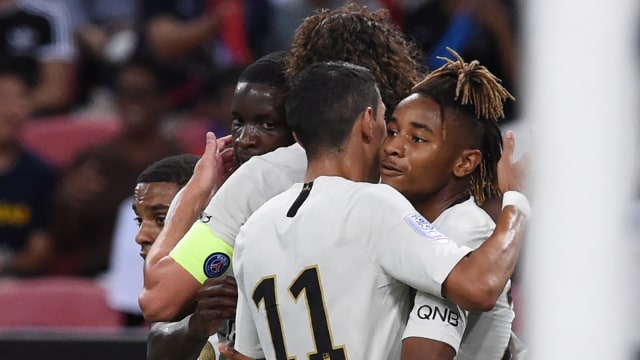 Para pemain Paris Saint-Germain merayakan gol ke gawang Atletico Madrid di partai International Champions Cup. (Foto: Roslan Rahman/AFP)
