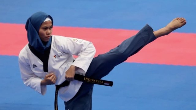 Defia Rosmaniar meraih medali emas cabang olahraga Taekwondo. (Foto:  Dok. kemenpora)