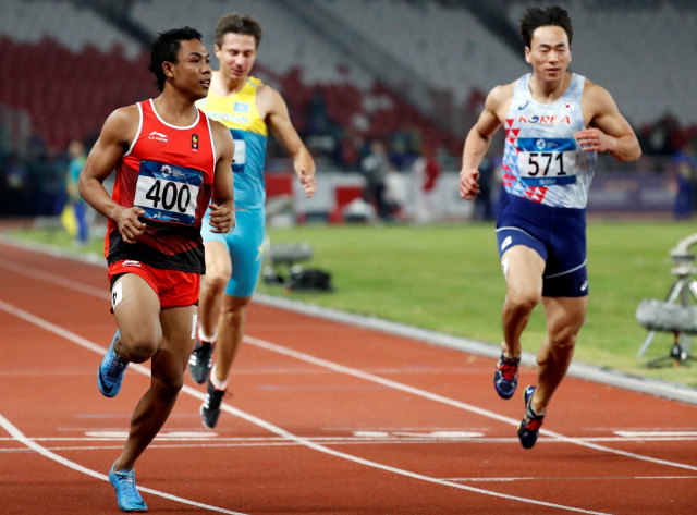 Lalu Muhammad Zohri berhasil menempati posisi pertama pada ronde 1, heat 3, kategori lari 100 meter putra. (Foto: Reuters/Darren Whiteside)