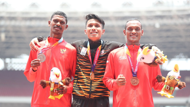 Kolymau Felipus dan Tine Endi Nurdin memenangi medali perak dan perunggu Asian Para Games di cabor lari 400 meter. (Foto: Dok. Kemenpora)