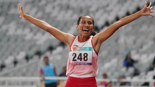 Ni Made Arianti Putri rayakan torehan perak di nomor lari 100 meter putri T13 (Foto: The Jakarta Post Images: INAPGOC/Steffan sihombing;)