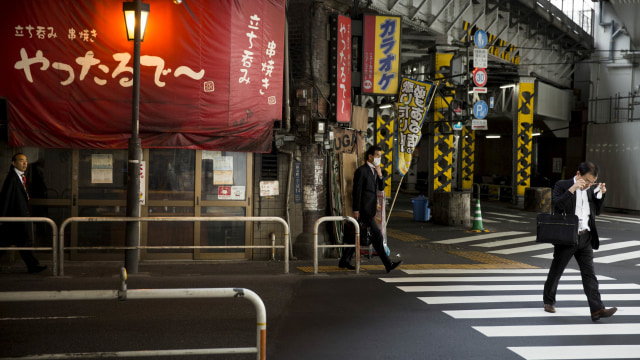 Ilustrasi pekerja Jepang Foto: REUTERS/Thomas Peter