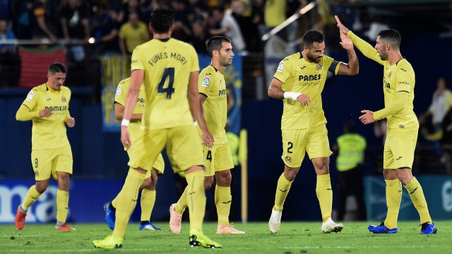 Pemain Villarreal rayakan gol Mario Gaspar di laga melawan Atletico Madrid (Foto: JOSE JORDAN / AFP)