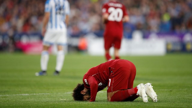 Selebrasi Mohammed Salah usai mencetak gol ke gawang Huddersfield Town di pekan kesembilan Premier League 2018/19. (Foto:  Reuters/Carl Recine)