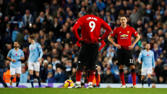 Ekspresi para pemain Manchester United saat Manchester City merayakan gol. Foto: Jason Cairnduff/Reuters