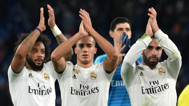 Real Madrid merayakan kemenangan atas AS Roma di Liga Champions. (Foto: Tiziana Fabi/AFP)