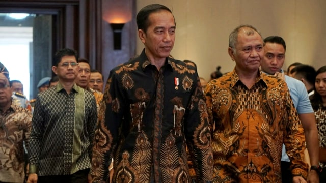 Presiden Joko Widodo (kiri) bersama Ketua KPK Agus Rahardjo di acara Hakordia 2018. Foto: Nugroho Sejati/kumparan