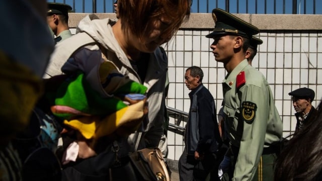 Ilustrasi polisi di China (Foto: AFP/Fred Dufour)